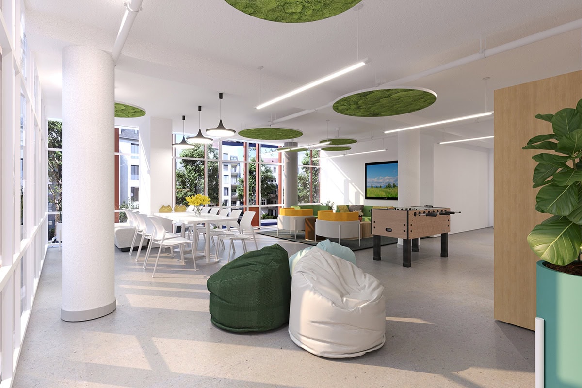 Adult lounge room has bean bag chairs and a foosball table