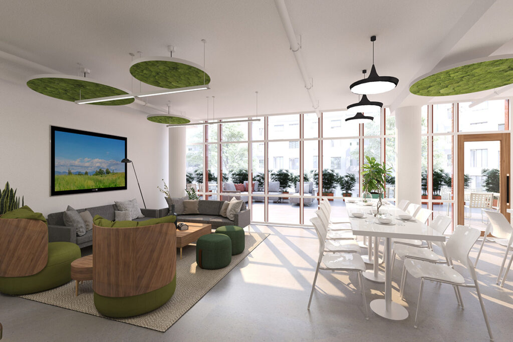 Indoor lounge area for adults. It's light and bright with white tables and brown leather chairs in the lounge area.