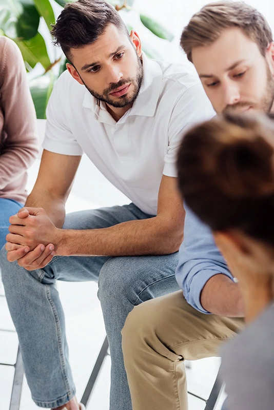 People participate in therapy at an Adderall addiction treatment center.