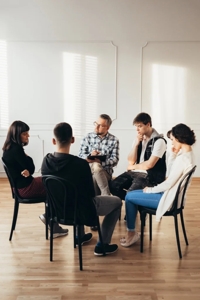People participate in therapy at a bipolar disorder treatment center.
