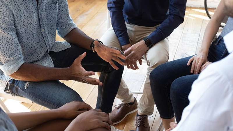People participate in therapy at a borderline personality disorder treatment center.