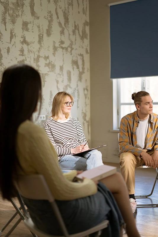 People participate in therapy at a borderline personality disorder treatment center.