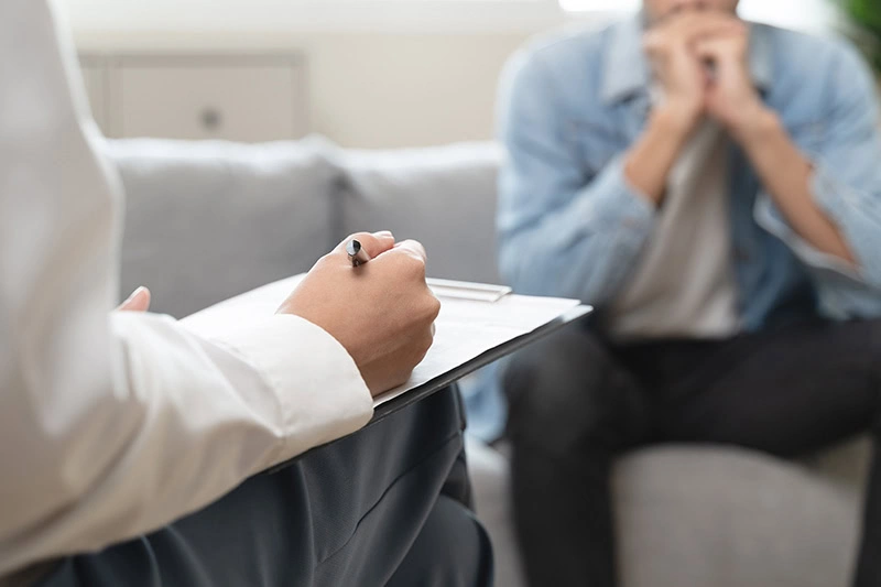 A person participates in therapy at a heroin rehab center.