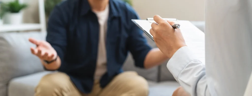 A person participates in therapy at a painkiller addiction rehab.