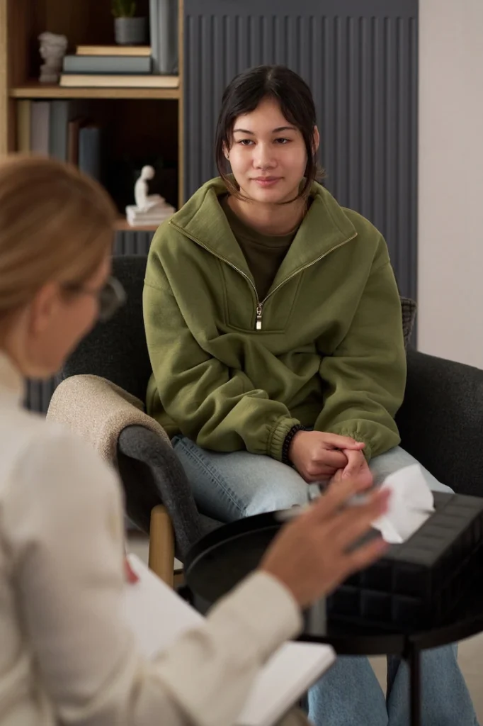 A person participates in therapy at a painkiller addiction rehab.