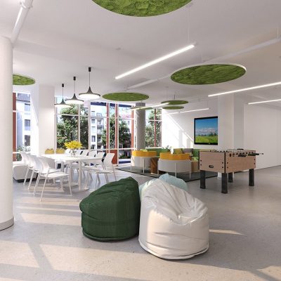 Adult lounge room has bean bag chairs and a foosball table